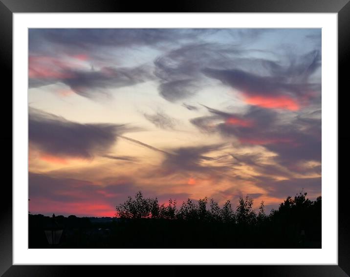 Swirly dramatic sunset  Framed Mounted Print by Roy Hinchliffe