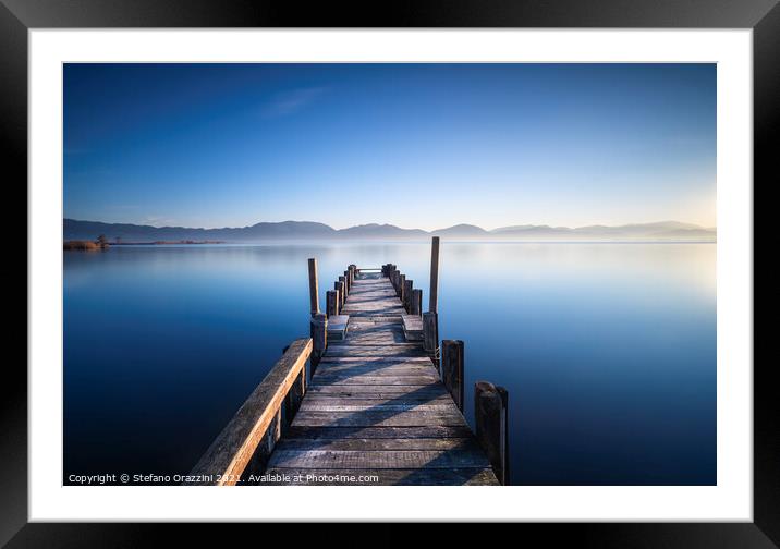 Pier in a Blue Lake Framed Mounted Print by Stefano Orazzini