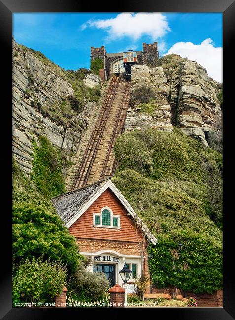 Rise Above Hastings Old Town and Rocky Shoreline Framed Print by Janet Carmichael