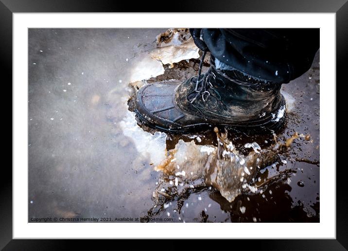 Boot cracking through an ice puddle Framed Mounted Print by Christina Hemsley