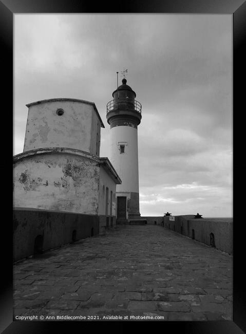 Lighthouse of Le Treport under stormy skys in mono Framed Print by Ann Biddlecombe