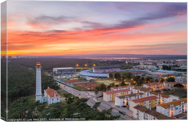 Aerial drone view of Vila Real de Santo Antonio city, lighthouse farol and stadium in Portugal, at sunset Canvas Print by Luis Pina