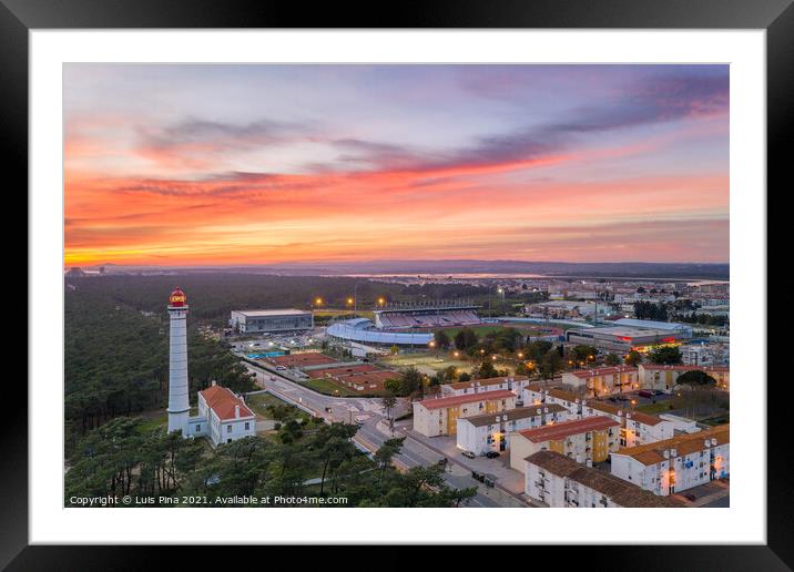 Aerial drone view of Vila Real de Santo Antonio city, lighthouse farol and stadium in Portugal, at sunset Framed Mounted Print by Luis Pina