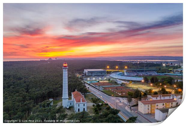 Aerial drone view of Vila Real de Santo Antonio city, lighthouse farol and stadium in Portugal, at sunset Print by Luis Pina