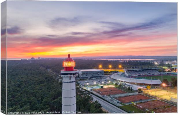 Aerial drone view of Vila Real de Santo Antonio city, lighthouse farol and stadium in Portugal, at sunset Canvas Print by Luis Pina