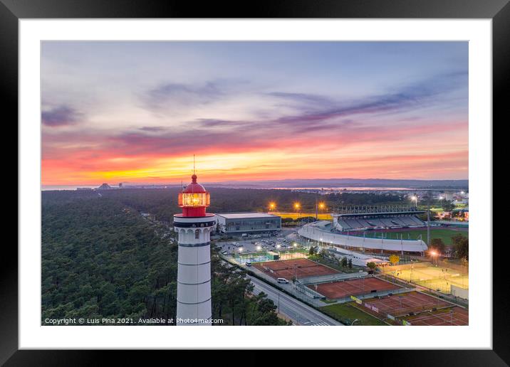 Aerial drone view of Vila Real de Santo Antonio city, lighthouse farol and stadium in Portugal, at sunset Framed Mounted Print by Luis Pina