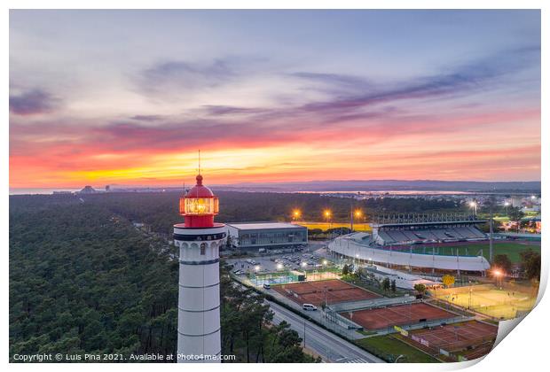 Aerial drone view of Vila Real de Santo Antonio city, lighthouse farol and stadium in Portugal, at sunset Print by Luis Pina