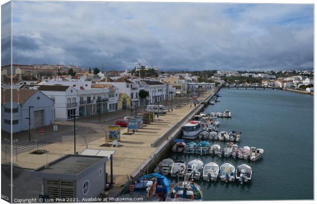 Tavira city view with boats in river gilao in Algarve, Portugal Canvas Print by Luis Pina