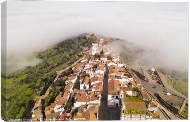 Monsaraz drone aerial view on the clouds in Alentejo, Portugal Canvas Print by Luis Pina