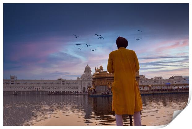 Amritsar, India: Unidentified Sikh Guard with spear standing and looking around near Sri Harmandir Sahib or Golden Temple pond against dramatic sunrise and birds in the sky Print by Arpan Bhatia