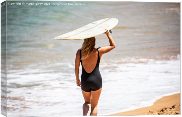 Woman Surfer carrying Surfboard Canvas Print by martin berry
