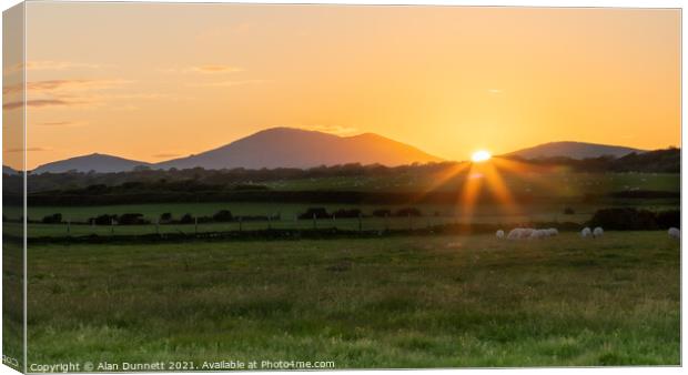 Sunset behind the Welsh Hills Canvas Print by Alan Dunnett