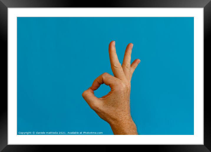 the symbol for the word okay Framed Mounted Print by daniele mattioda