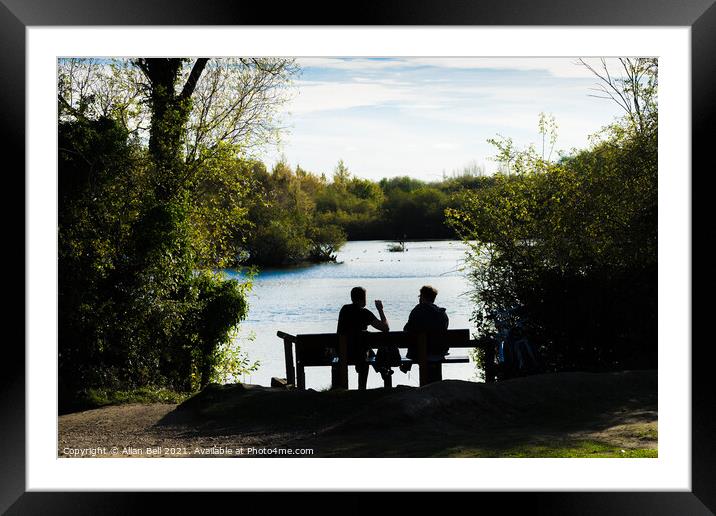 People Sitting by Lake Framed Mounted Print by Allan Bell