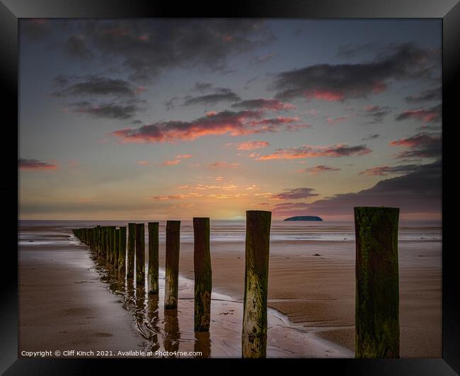 Sunset across Berrow Beach Framed Print by Cliff Kinch