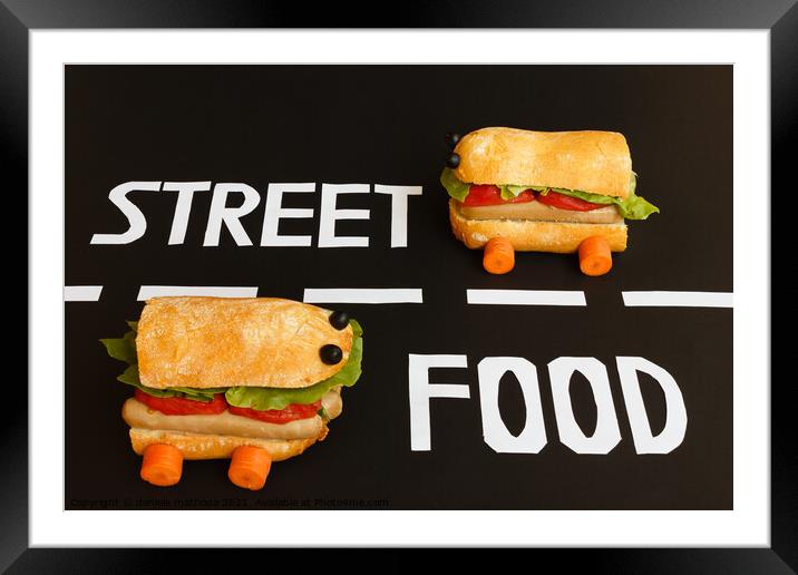 two sandwiches   shaped  car  represent the activity of street food Framed Mounted Print by daniele mattioda