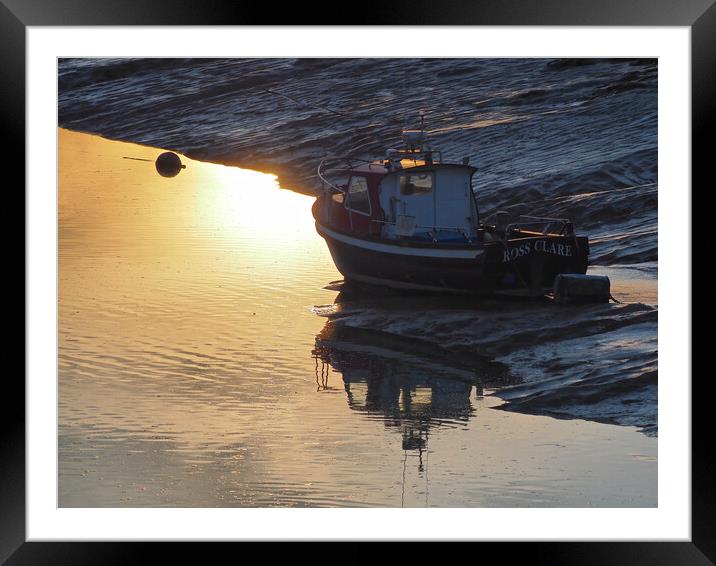 Golden Sunset with boat in water at Clevedon harbour, Somerset. Framed Mounted Print by mark humpage