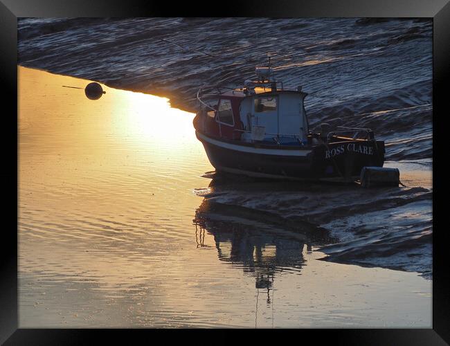 Golden Sunset with boat in water at Clevedon harbour, Somerset. Framed Print by mark humpage