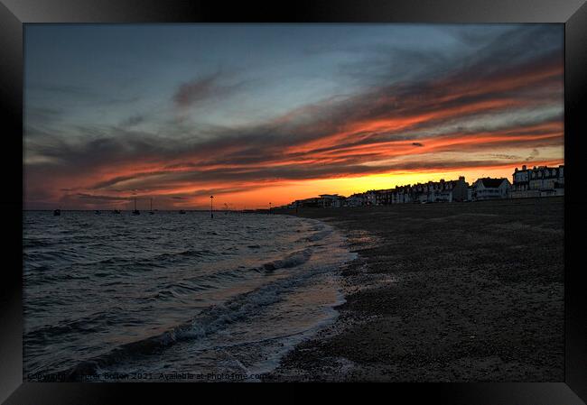 Sunset over the coast at Thorpe Bay, Essex. Framed Print by Peter Bolton