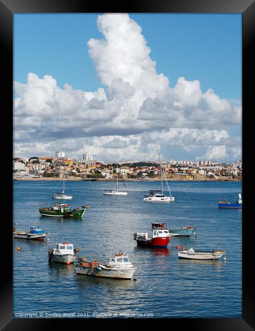 Fishing boats with clouds Framed Print by Dudley Wood