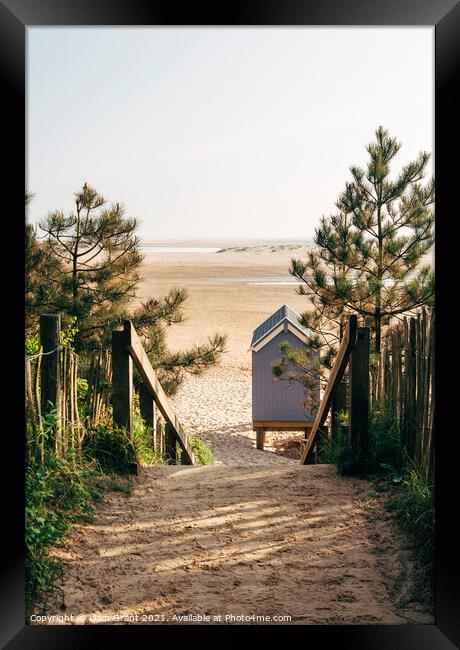 Beach hut and path to beach at sunrise. Wells-next-the-sea, Norf Framed Print by Liam Grant