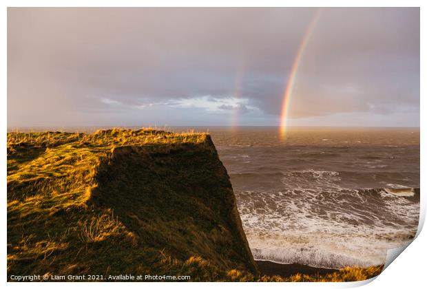 Rainbow and stormy sky at sunset. Sheringham, Norfolk, UK. Print by Liam Grant
