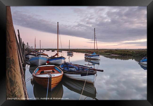 Boats moored in Blakeney Harbour at dawn. Norfolk, UK. Framed Print by Liam Grant