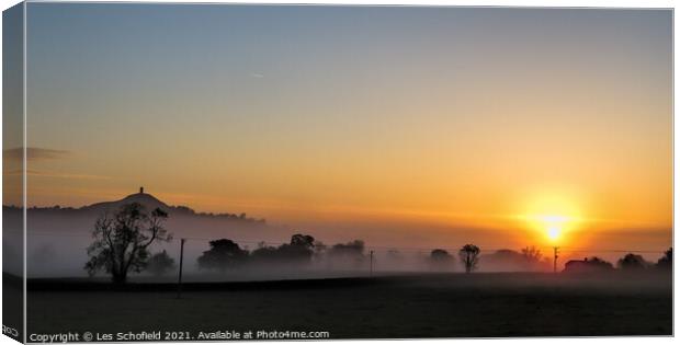 Majestic Sunrise over Glastonbury Tor Canvas Print by Les Schofield