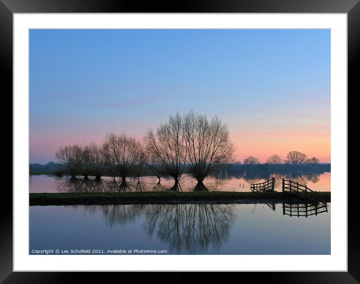 Tree reflection over body of water  Framed Mounted Print by Les Schofield