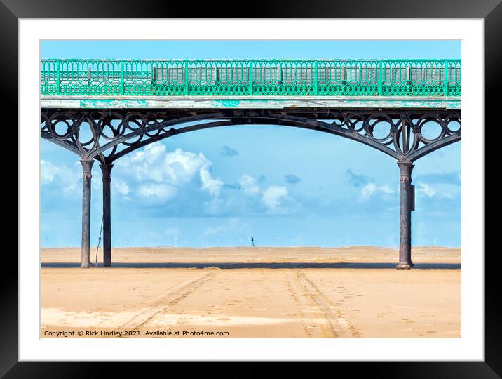 Walking Under Pier Framed Mounted Print by Rick Lindley