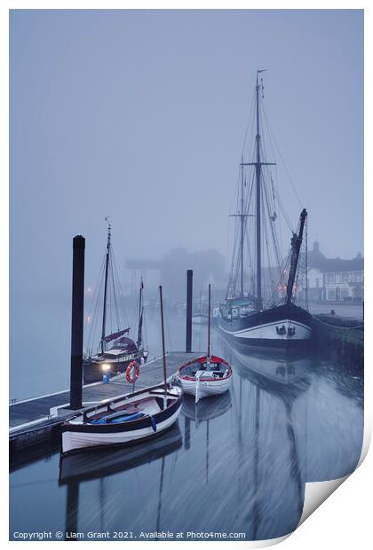 Boats moored in the harbour in fog at dawn. Wells-next-the-sea, Print by Liam Grant