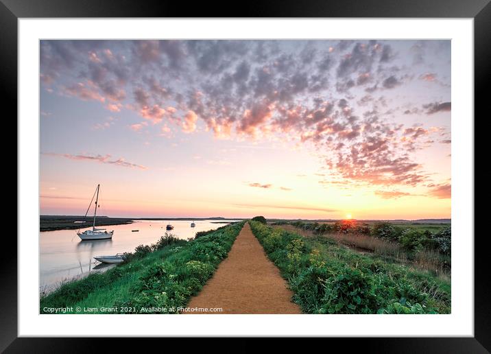 Boats and footpath at sunrise. Burnham Overy Staithe, Norfolk, U Framed Mounted Print by Liam Grant