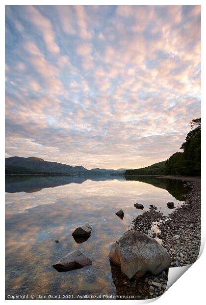 Reflections on the surface of Coniston Water at sunrise. Cumbria Print by Liam Grant