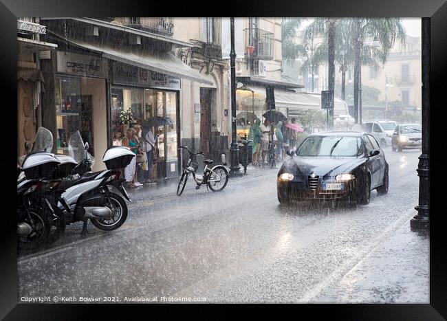 Heavy rain downpour in Sorrento, Italy Framed Print by Keith Bowser