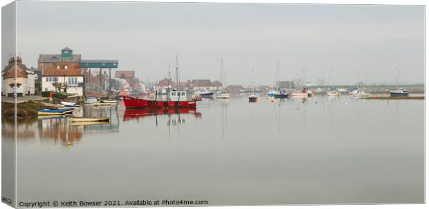 Wells Next The Sea harbour at high tide with mist Canvas Print by Keith Bowser