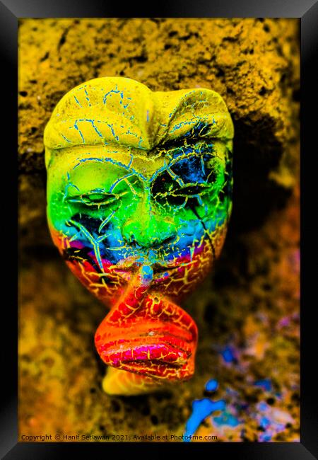 A Bali face mask with finger on its mouth. Framed Print by Hanif Setiawan