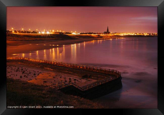 Old sea bathing pool and Tynemouth Church at night. Northumberla Framed Print by Liam Grant