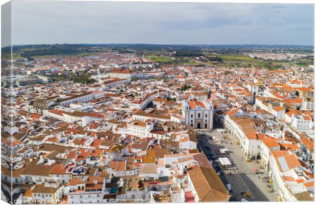 Evora drone aerial view on a sunny day with historic buildings city center and church in Alentejo, Portugal Canvas Print by Luis Pina