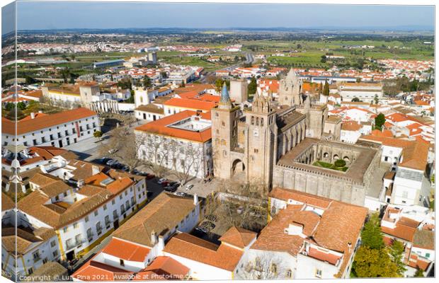 Evora drone aerial view on a sunny day with historic buildings city center and church in Alentejo, Portugal Canvas Print by Luis Pina