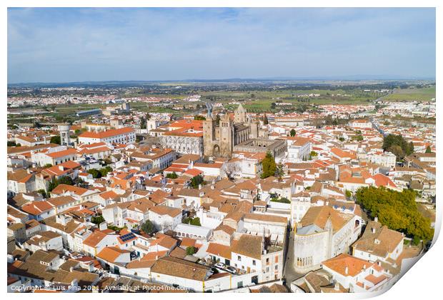 Evora drone aerial view on a sunny day with historic buildings city center and church in Alentejo, Portugal Print by Luis Pina