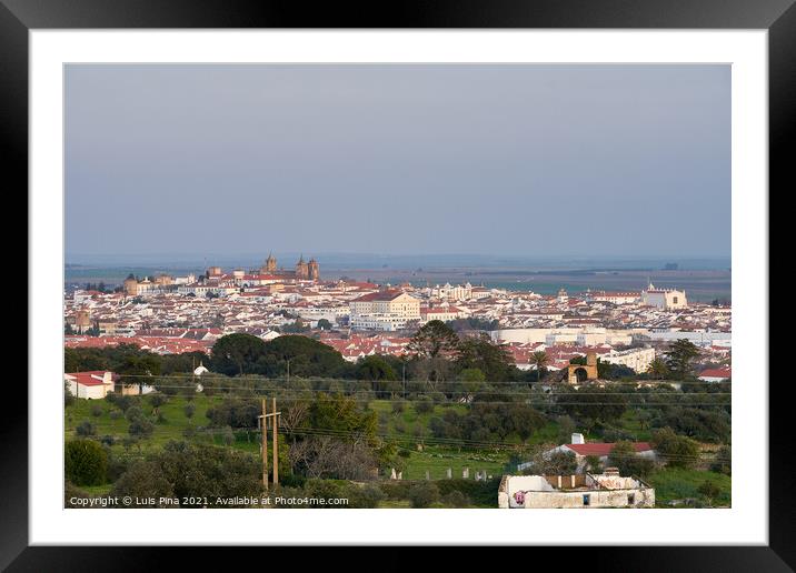 Evora city historic buildings and church view at sunset from a viewpoint on the outside in Alentejo, Portugal Framed Mounted Print by Luis Pina