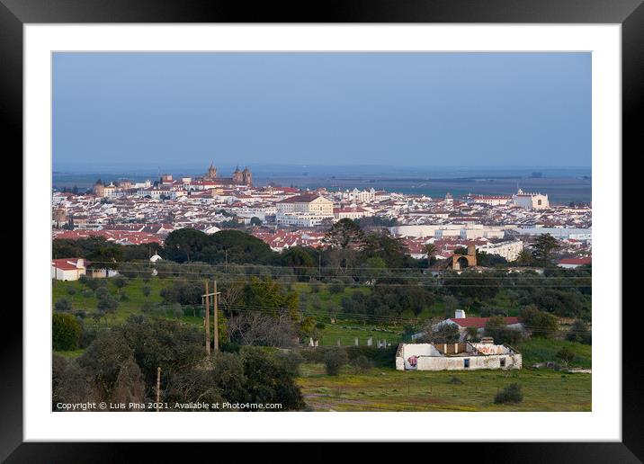 Evora city historic buildings and church view at sunset from a viewpoint on the outside in Alentejo, Portugal Framed Mounted Print by Luis Pina