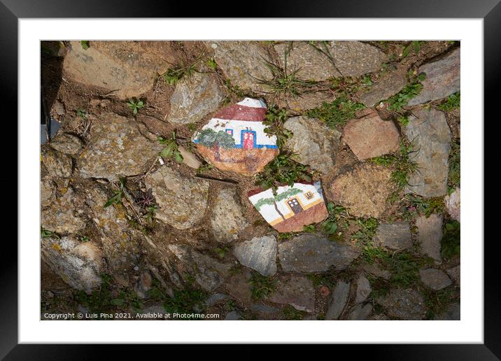 Beautiful painted typical houses in the sidewalk floor in Evoramonte Alentejo, Portugal Framed Mounted Print by Luis Pina
