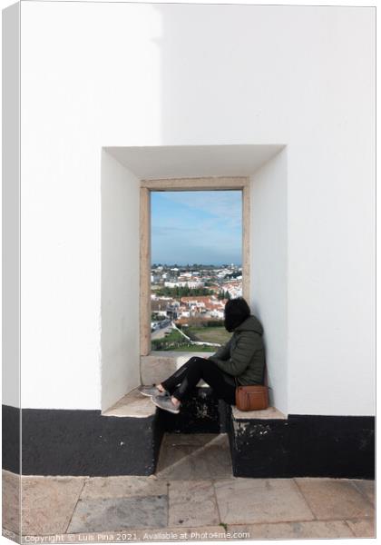 Woman girl traveler sit and looking through a white wall window Estremoz city and Alentejo landscape, in Portugal Canvas Print by Luis Pina