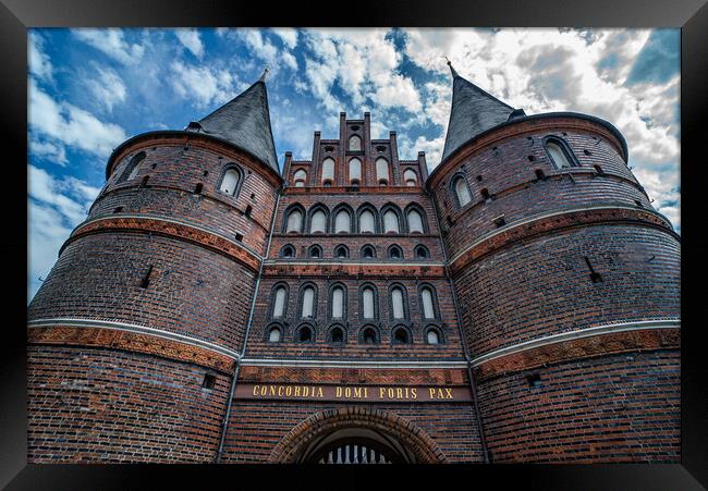 Famous Holsten Gate in the city of Lubeck Germany - CITY OF LUBECK, GERMANY - MAY 10, 2021 Framed Print by Erik Lattwein
