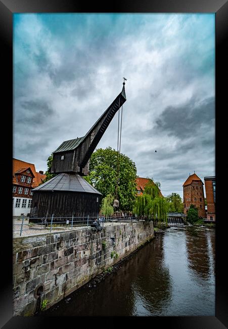 Old crane at the Historic city of Luneburg Germany - CITY OF LUENEBURG, GERMANY - MAY 10, 2021 Framed Print by Erik Lattwein