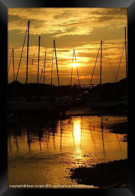 Sunset view trickle of water over stones. Framed Print by Dean Knight