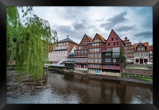 Beautiful old buildings in the historic city of Luneburg Germany - CITY OF LUENEBURG, GERMANY - MAY 10, 2021 Framed Print by Erik Lattwein