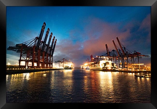 Port of Hamburg with its huge container terminals by night - CITY OF HAMBURG, GERMANY - MAY 10, 2021 Framed Print by Erik Lattwein
