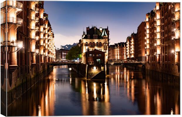 Historic warehouse district in the city of Hamburg by night - CITY OF HAMBURG, GERMANY - MAY 10, 2021 Canvas Print by Erik Lattwein